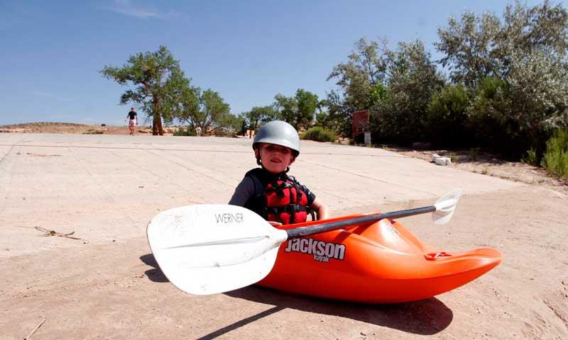 Kid Learning to Kayak